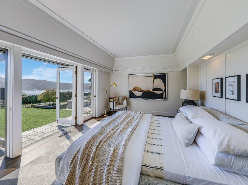 White bedroom with hardwood floors