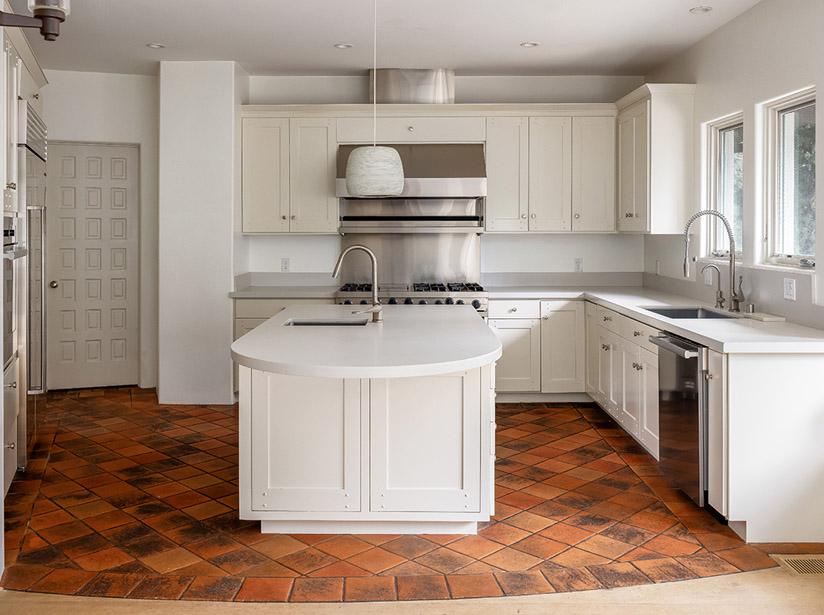 Dark kitchen with wood paneling