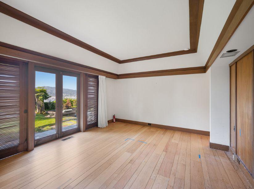 Dark bedroom with wood paneling